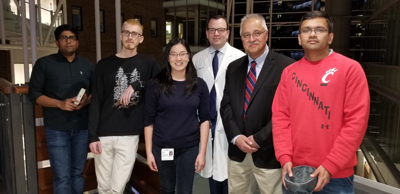 The project team poses together.