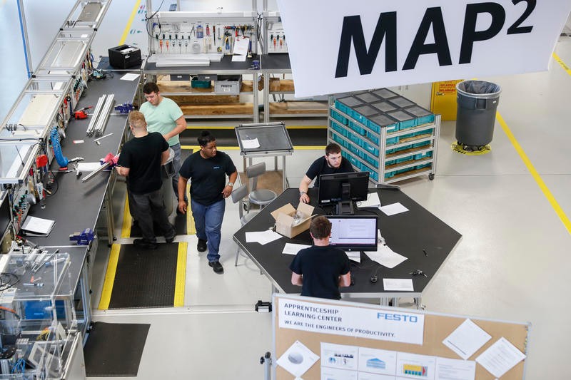 people work in a factory