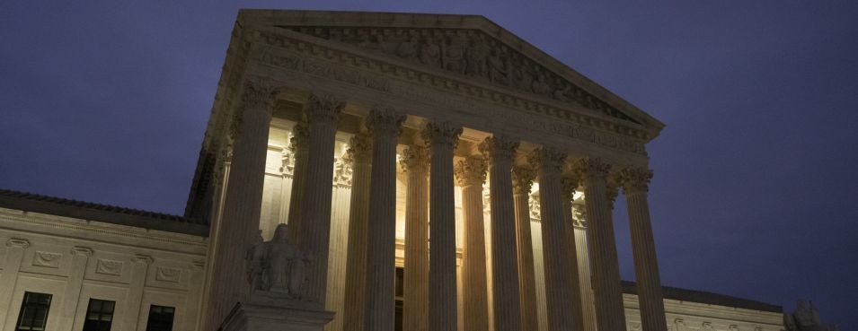 u.s. supreme court building at night