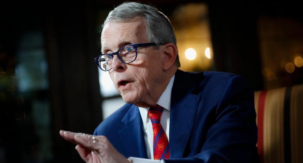 Governor Mike DeWine speaking at a meeting