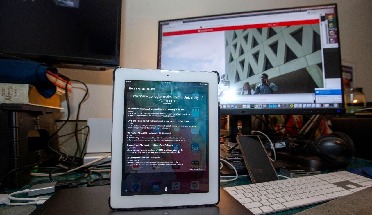 Charlie W. Fuqua III, second year student at University of Cincinnati used Siri on his Iphone and Ipad at his home in Westwood. Photo Illustration for a Boyang Wang story. UC/Joseph Fuqua II