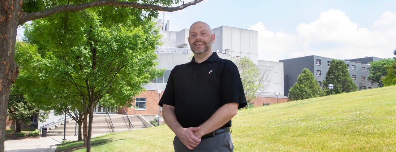 Bobby Gray poses on sunny campus