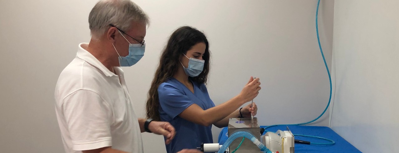 Employees working on making a ventilator