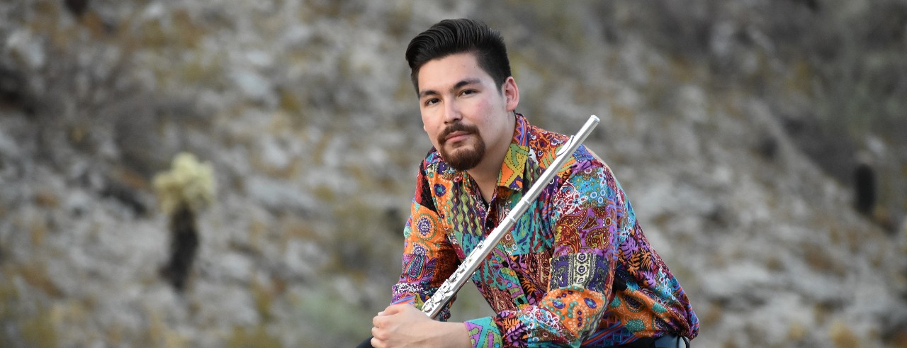 Chaz Salazar poses with his flute