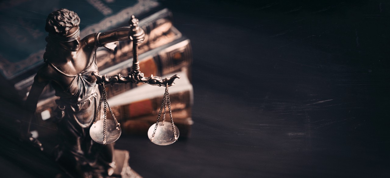 scales of justice with law books