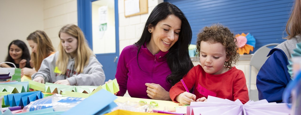 Dr. Maria Espinola with smiling children.