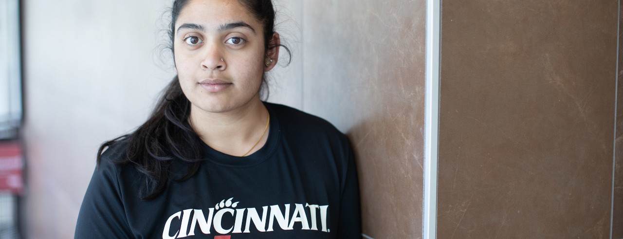 woman wearing black UC shirt