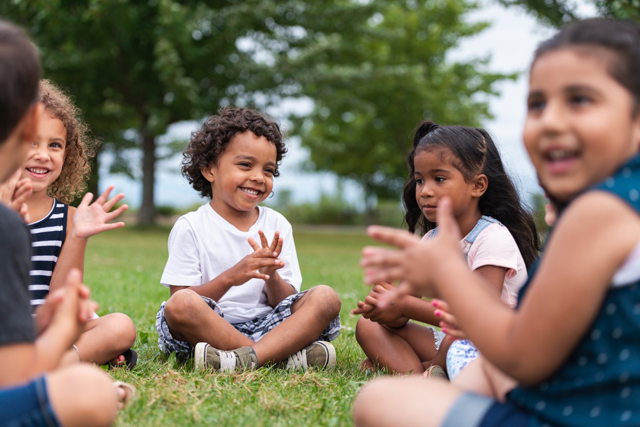 children playing in the grass