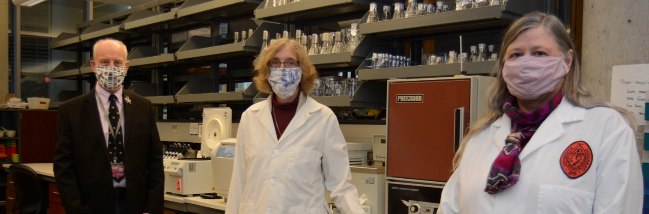 Dr. Iain Cartwright, Dr. Carolyn Price and Dr. Alison Weiss standing in a UC College of Medicine lab.