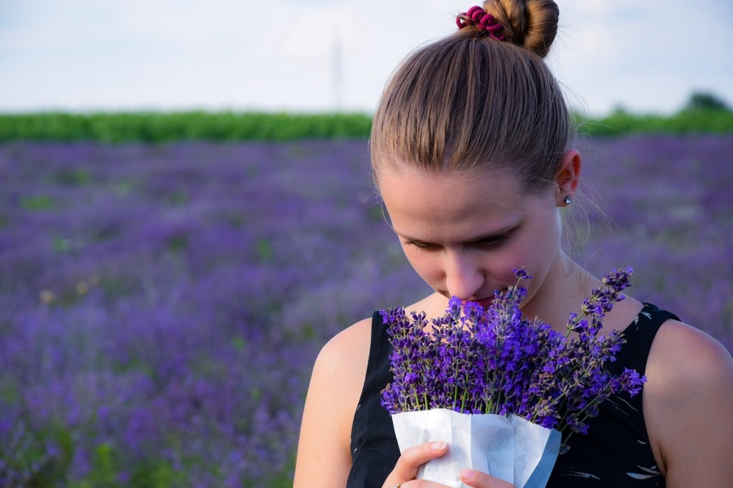 woman smells flowers