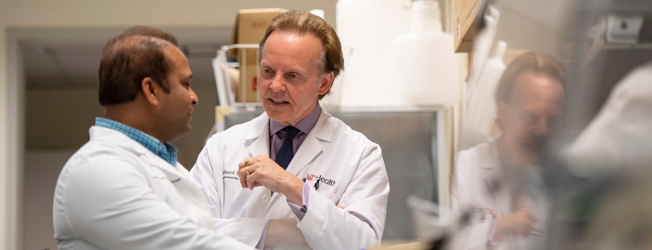 Richard Becker, MD, (center) shown with a colleague in the UC College of Medicine