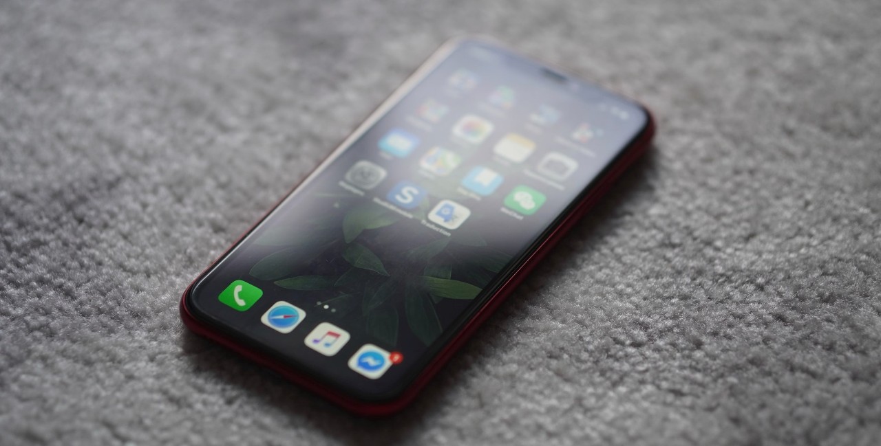 cell phone with social media apps on screen