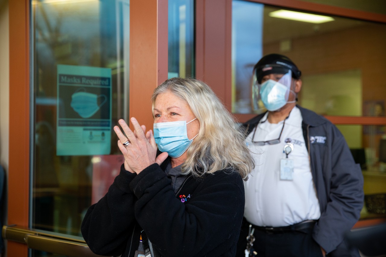 Members of the UC community, including Jack Miner and the Bearcat, surprise Mohamed Camara to congratulate him on his admission to UC.