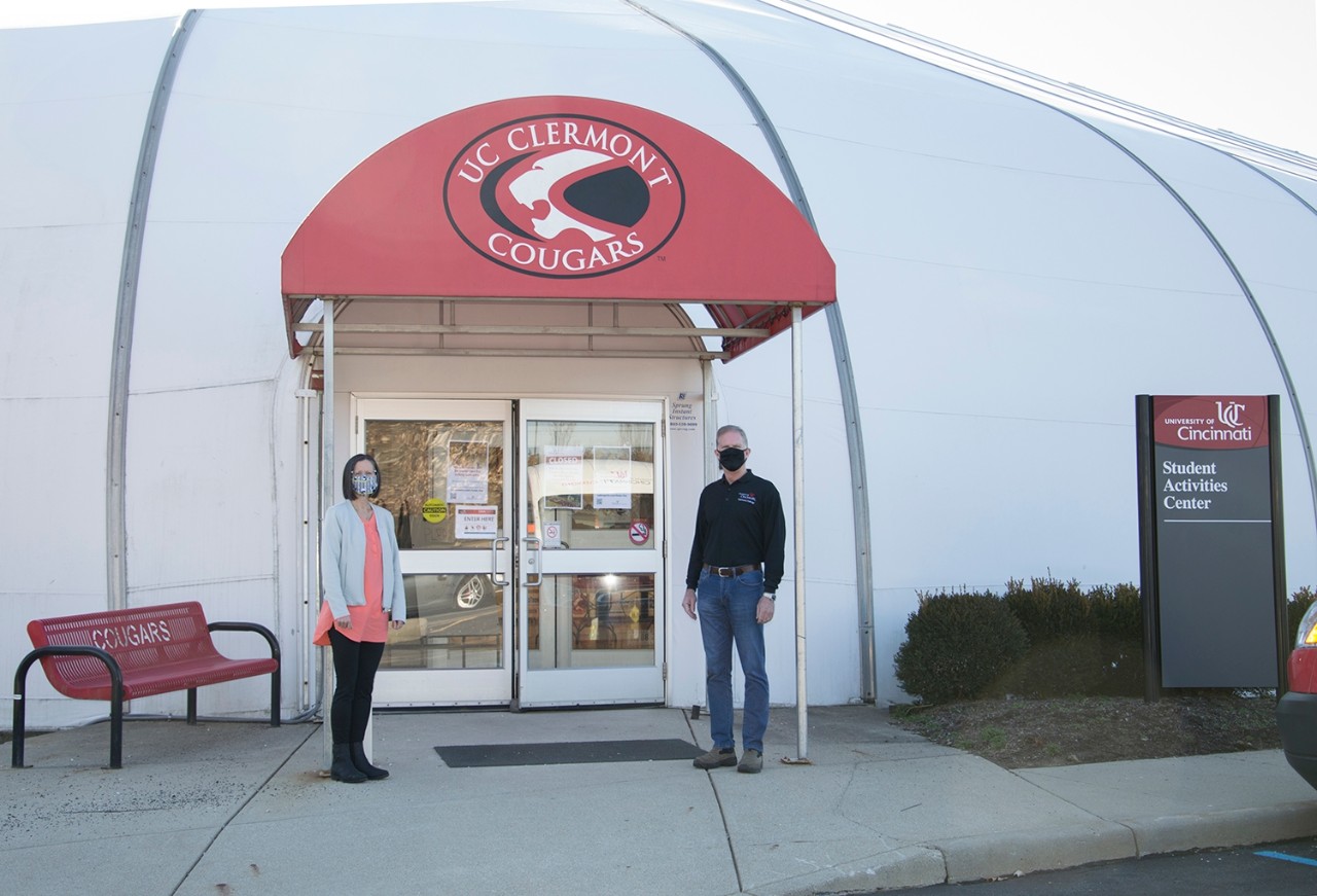 Health Commissioner Julianne Nesbit and Dean Jeff Bauer of UC Clermont College in front of the college’s Student Activities Center, the new Clermont County Public Health vaccination site. 