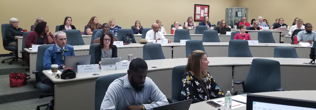 members of UC's staff senate participate in a meeting. 
