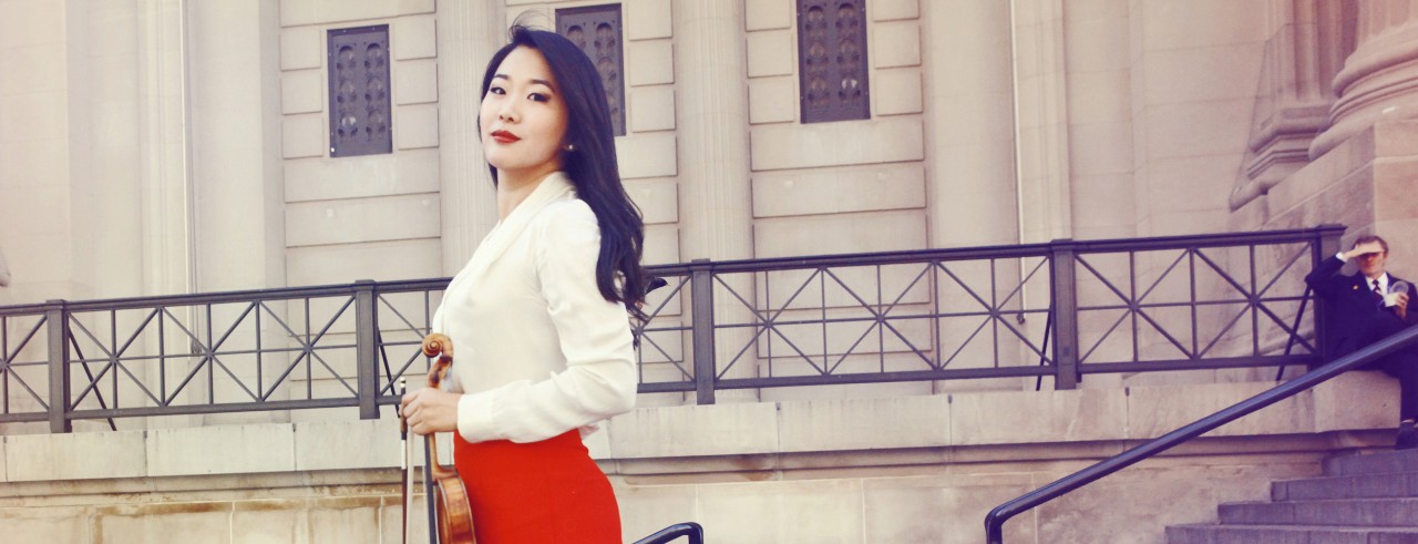 A photograph of new CCM faculty member Kristin Lee holding her violin. Photo/Sophie Zhai