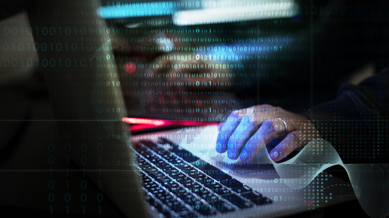 Businessman on phone standing in front of a city skyline