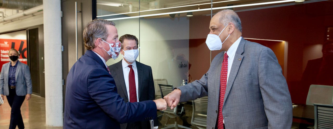 Ohio Lt. Gov. Jon Husted bumps fists with UC President Neville G. Pinto in the 1819 Innovation Hub.