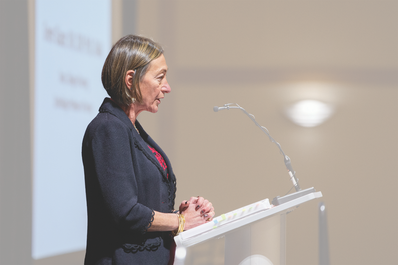 Forder Dean Greer Glazer speaks at a podium