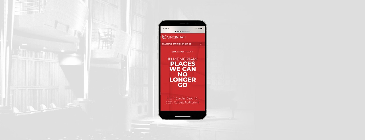 A photo of a smartphone accessing CCMs new digital programs within Corbett Auditorium.