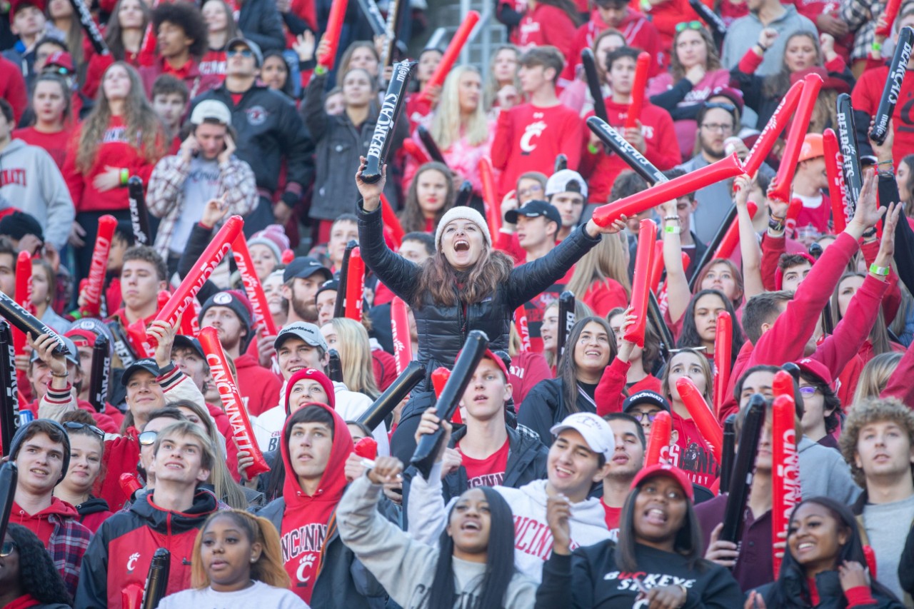 image of Bearcat fans waving batons. 