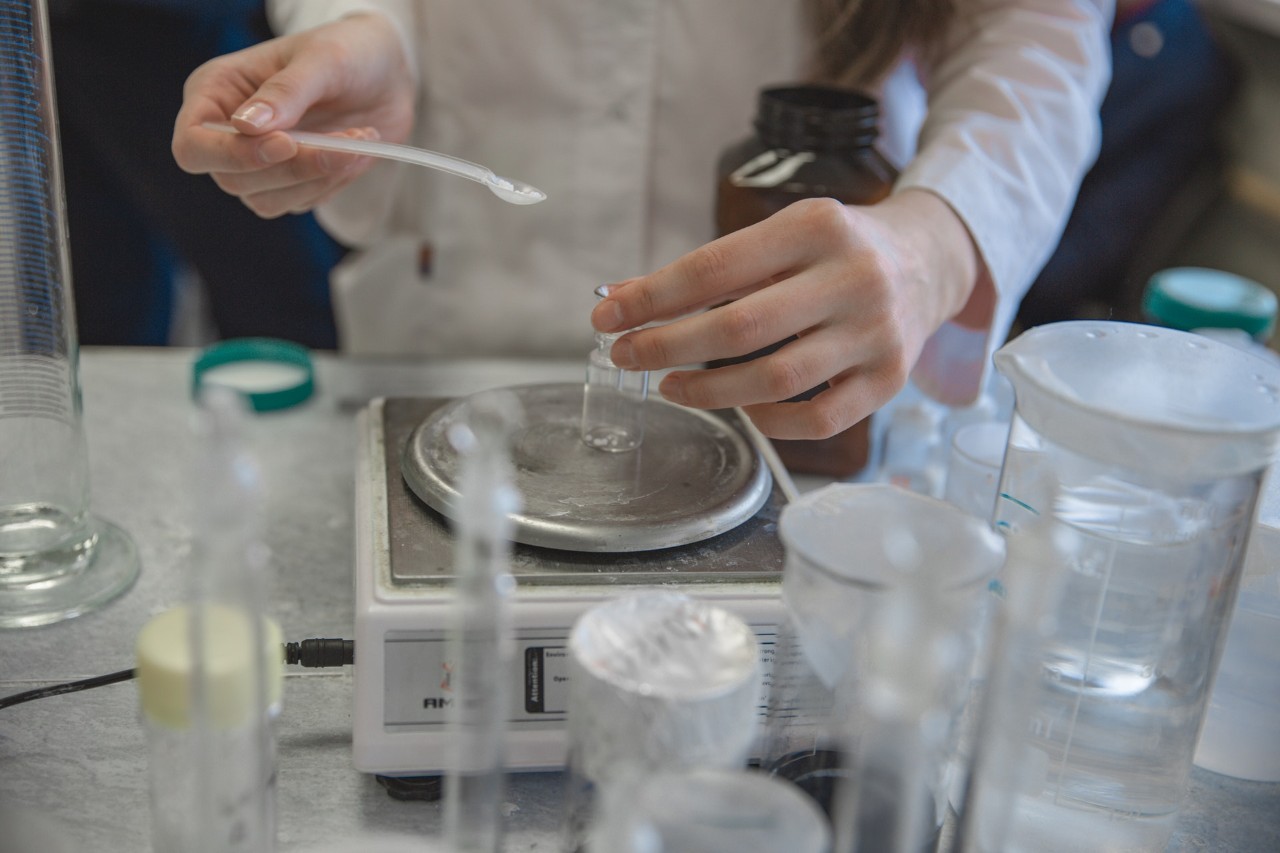 Person measuring chemicals