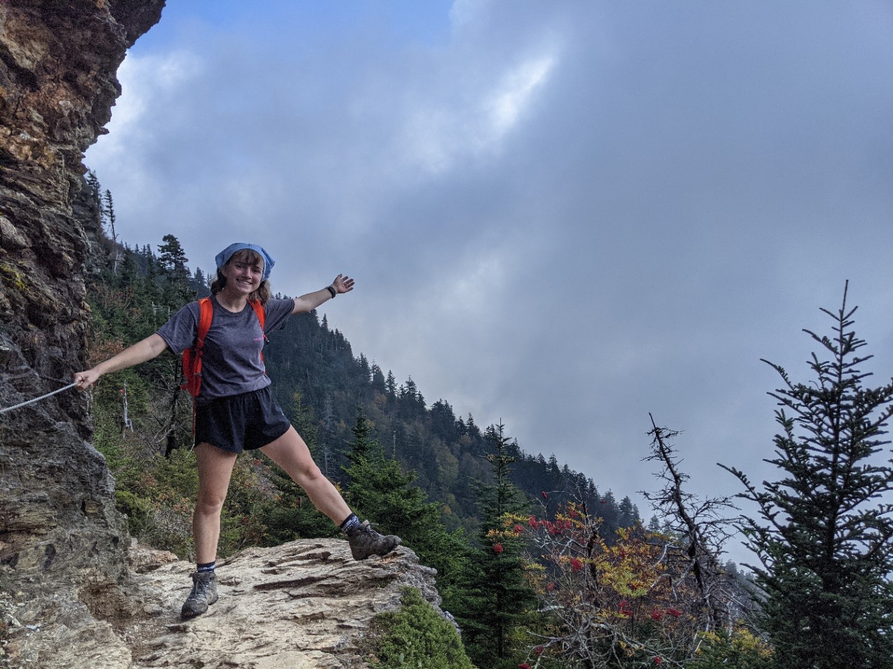 Bailey backpacking on the side of a mountain