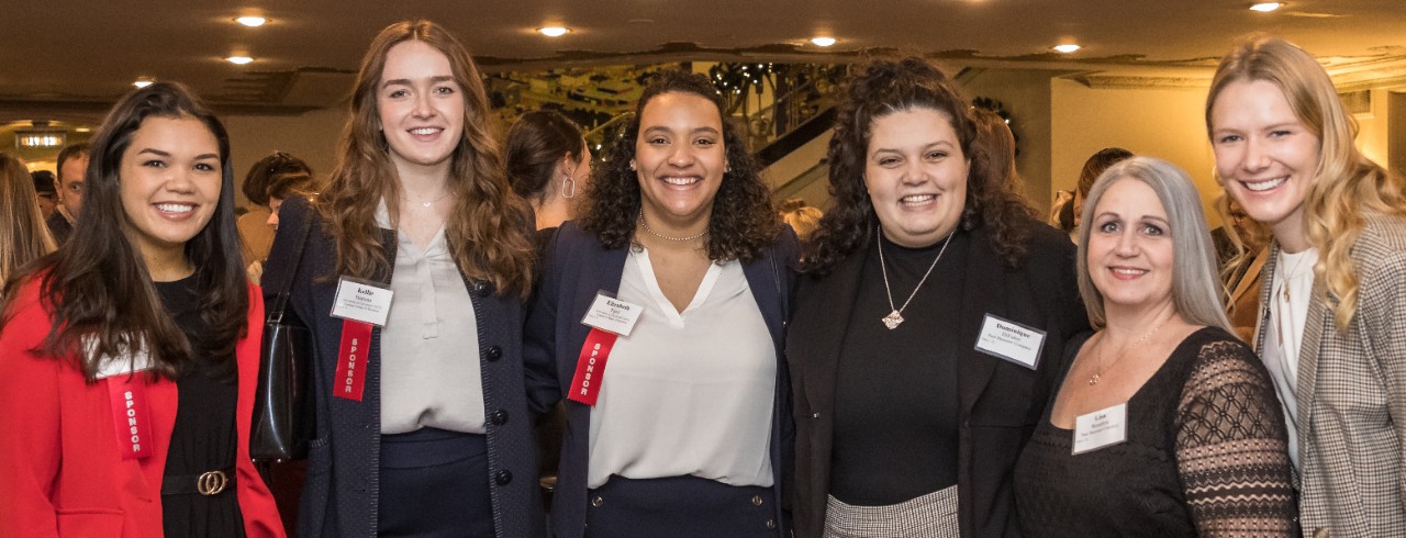 Students and company representatives pose for a picture at Cincinnati Business Courier’s Women Who Mean Business luncheon.