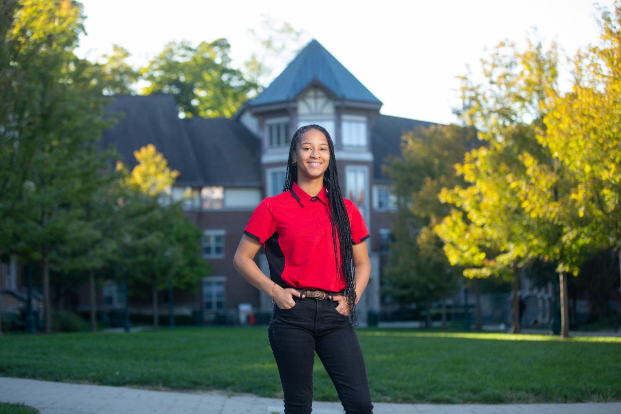 Karrington Rainey in front of her residence hall 