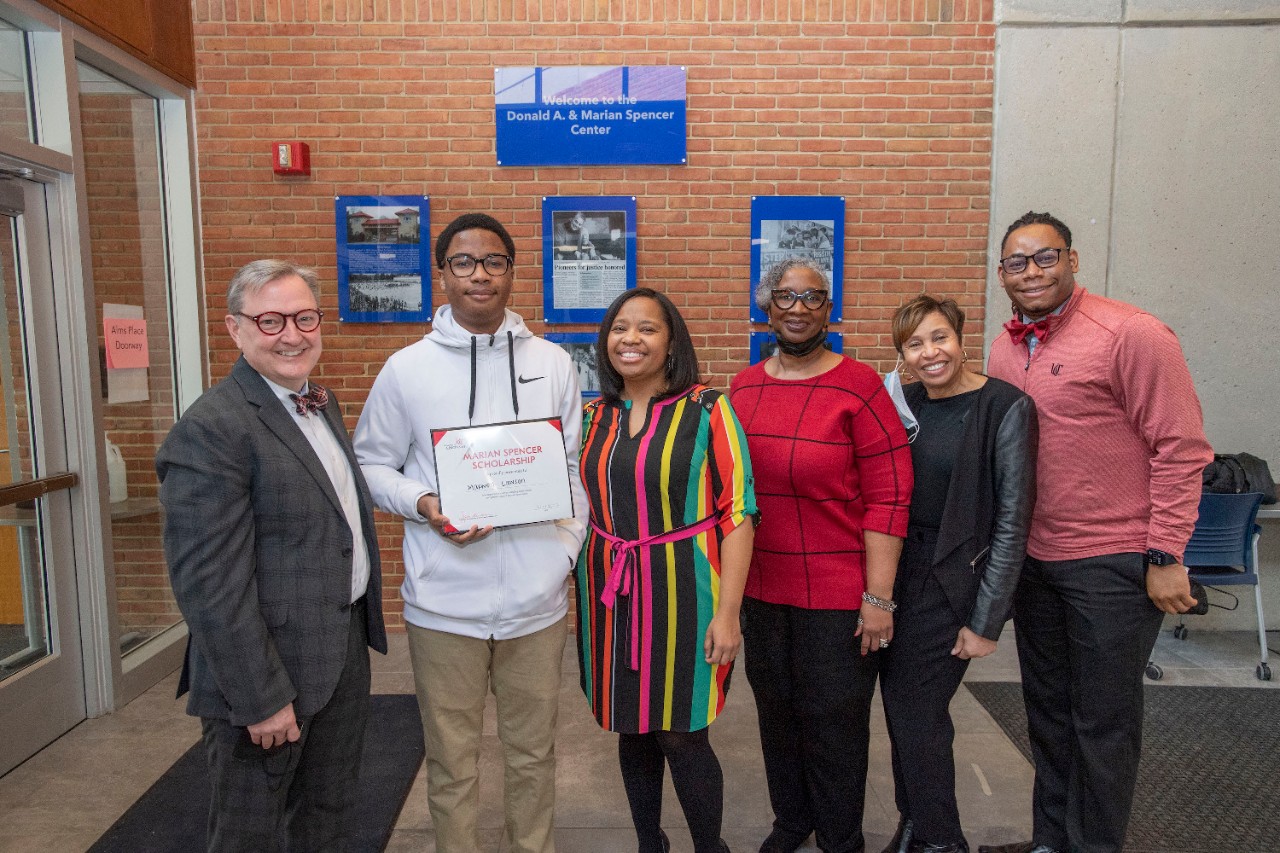 Jack Miner, Vice Provost for Enrollment Management surprised Maxwell Lawson future UC Bearcats with Marian Spencer Scholarship award at Spencer Center Tuesday February 1, 2022. Marian Spencer Scholarship award students with full tuition, room and board and an all-expenses-paid study abroad experience from the University of Cincinnati. Photos by Joseph Fuqua II