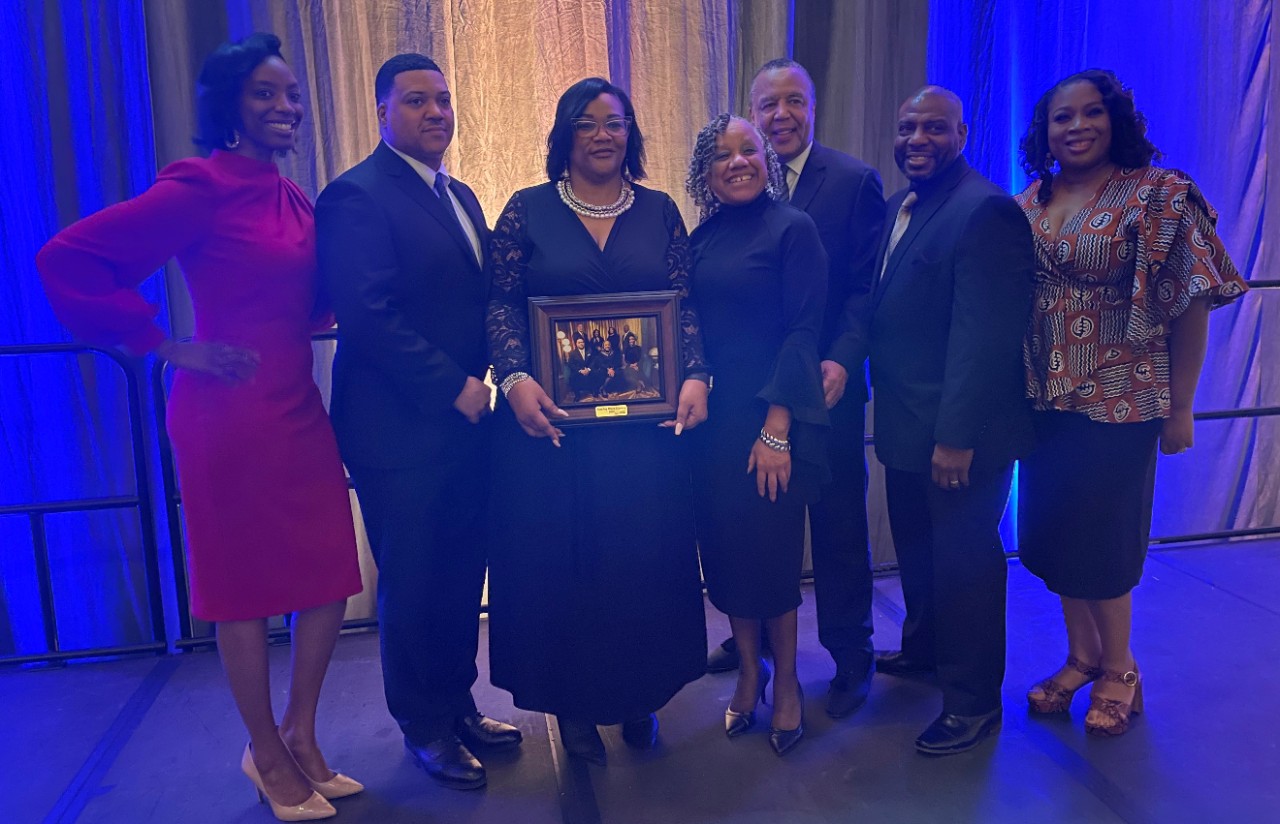 A group of people pose for a photo.