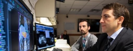 Jordan Kharofa sits at a computer 