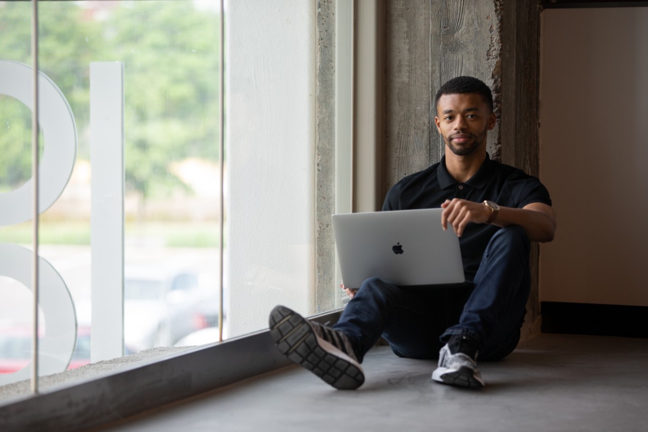 Student sitting with a laptop