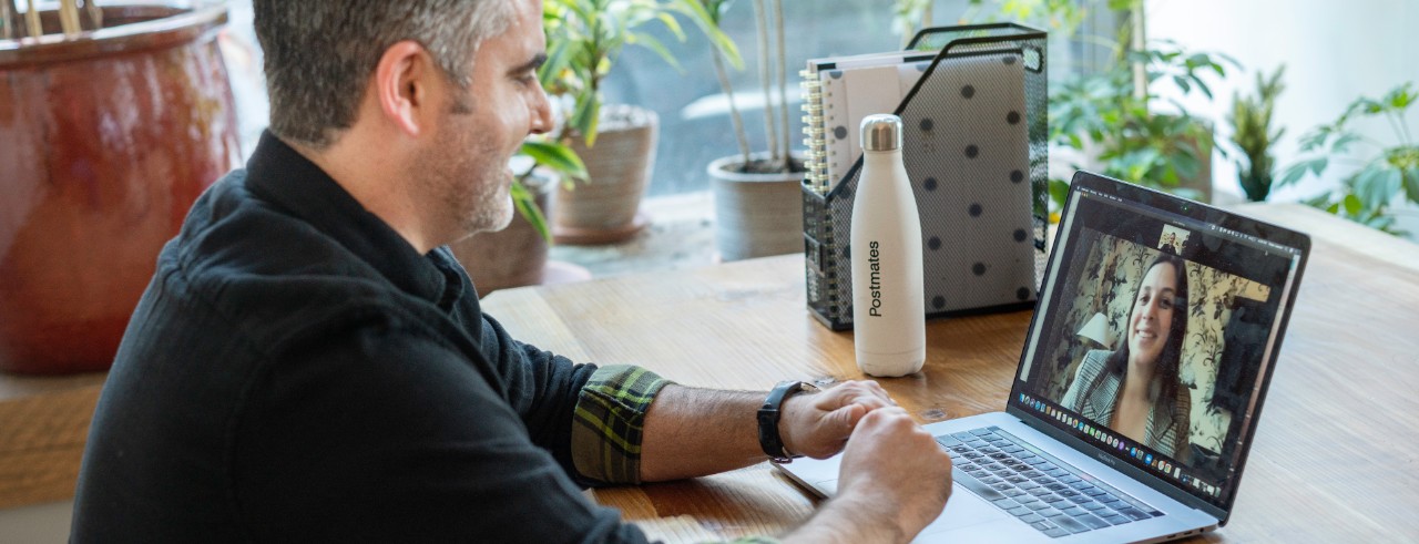 A man in a virtual meeting.