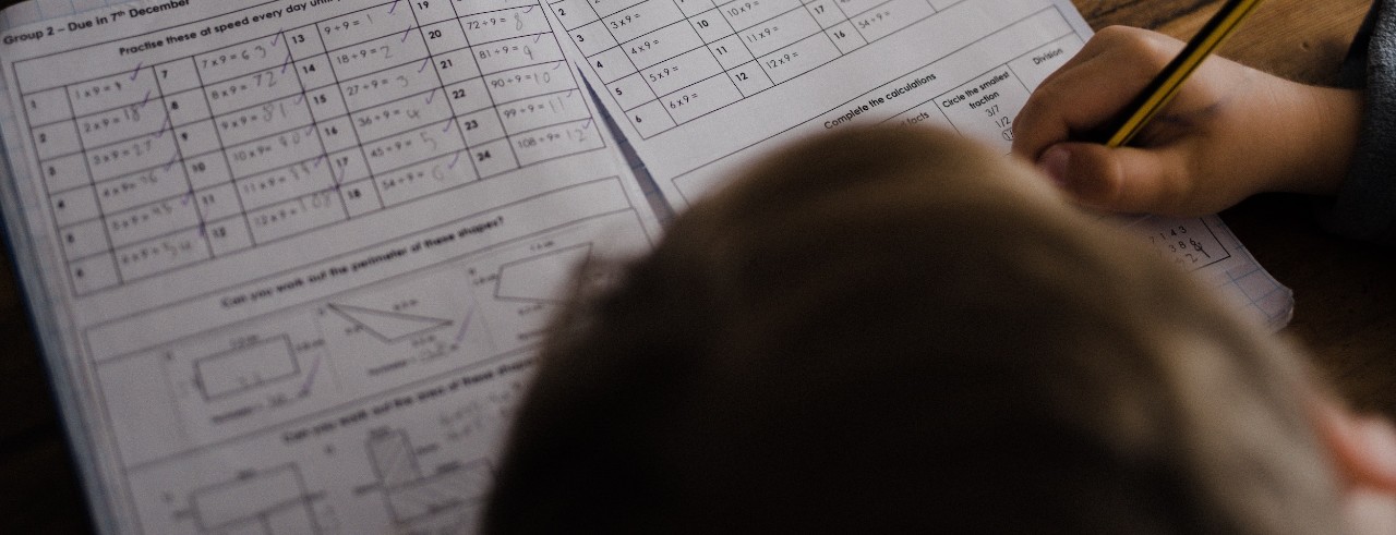Overhead view of student taking paper test