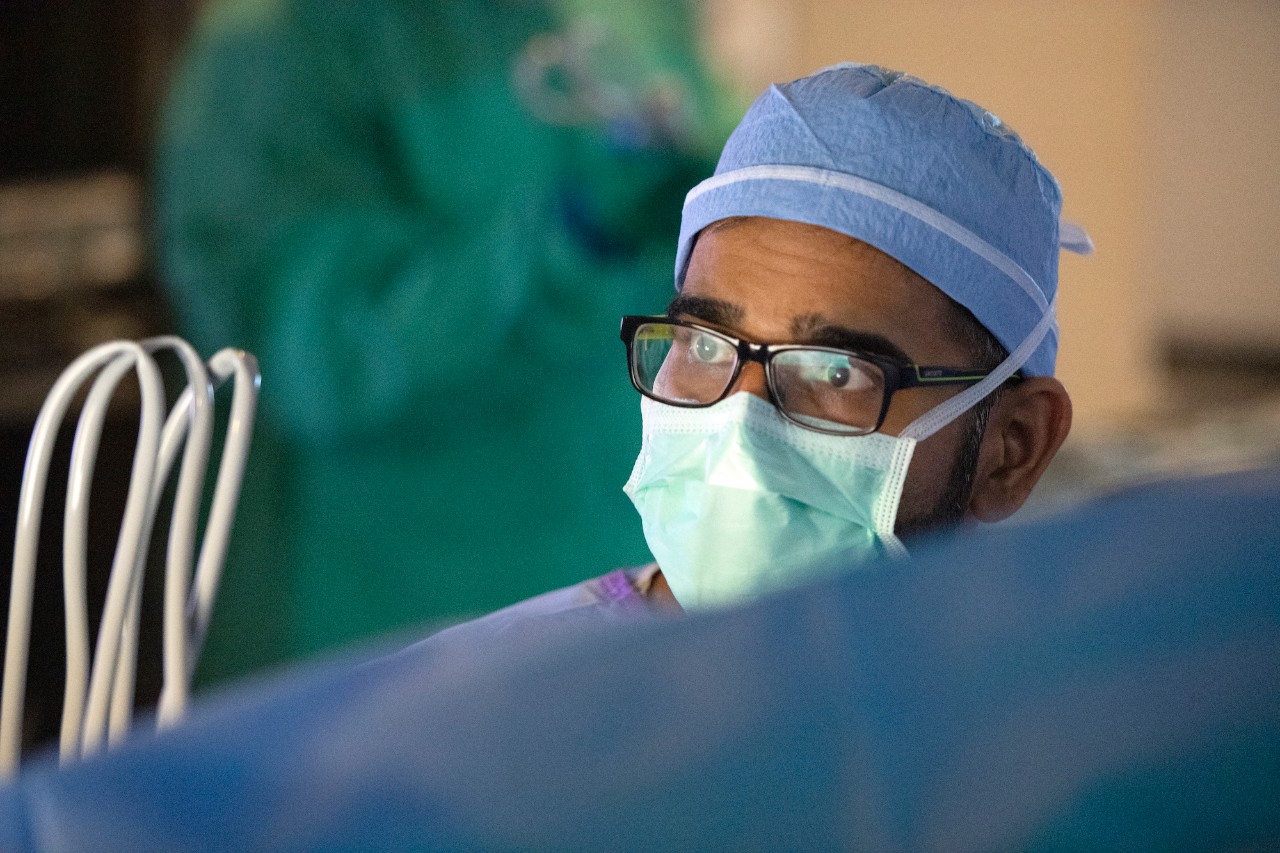 Dr. Sidana wears a mask during surgery