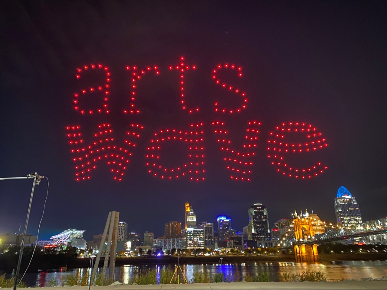 Drones form the shape of the ArtsWave logo above the Ohio River during Cincinnati's 2022 BLINK Festival. Photo/Roza Gavriilidis