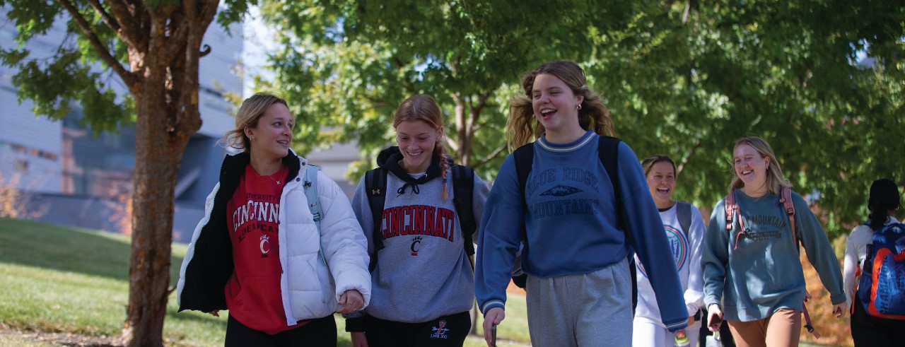 students walking on campus in the fall