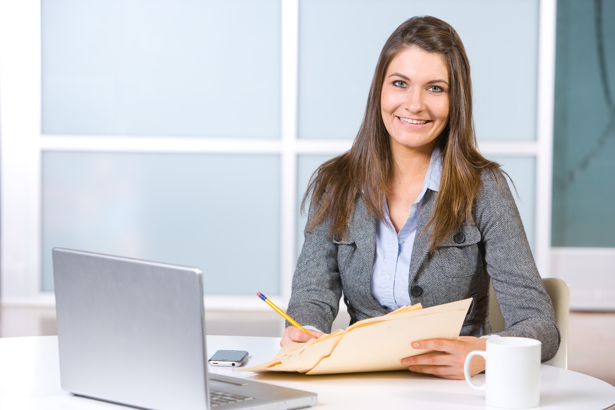 Law student studies with computer and files