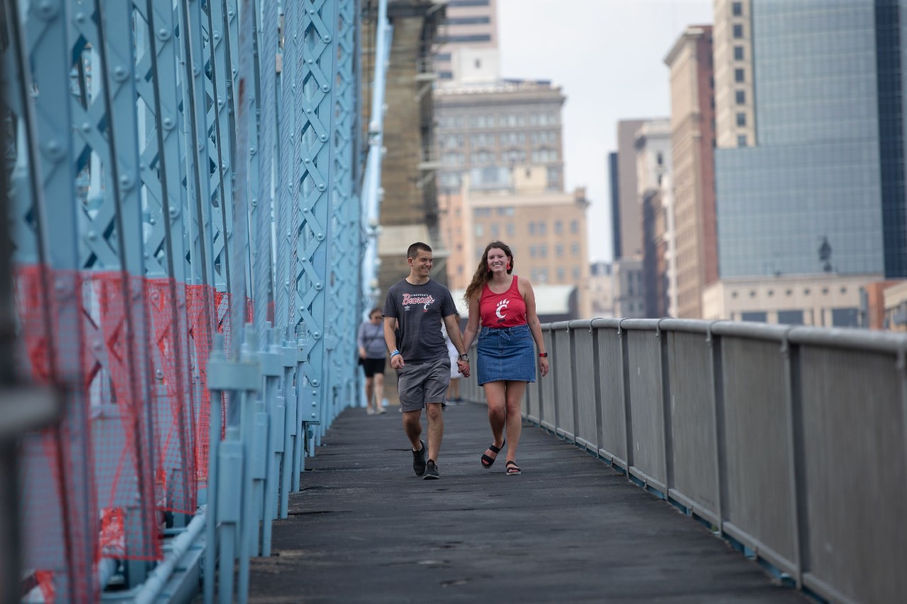 Two UC students walk across bridge connecting Cincinnati to Northern Kentucky