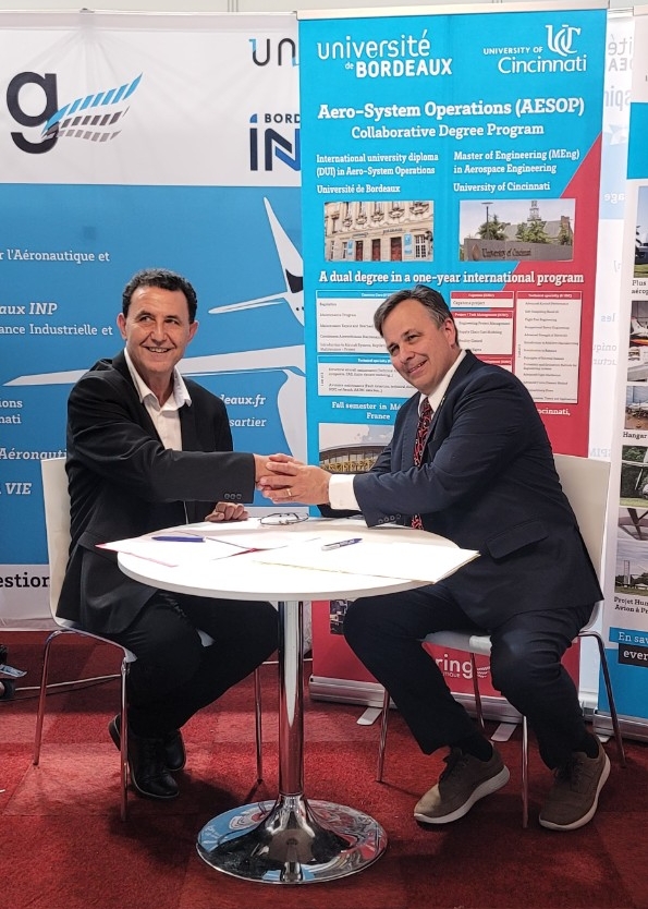 Wahbi Jomaa and Paul Orkwis shake hands