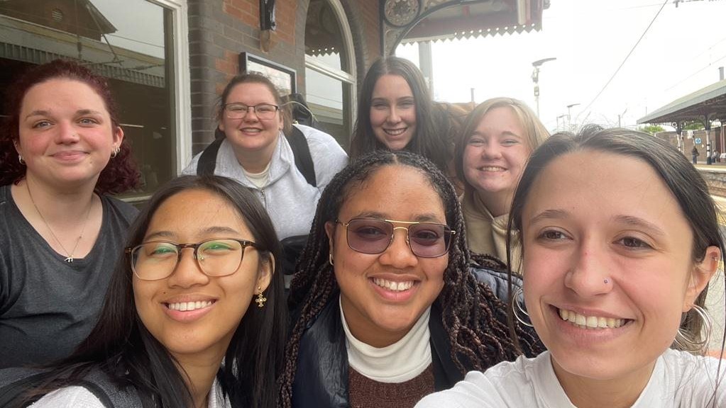 Group selfie of students while at London bus stop