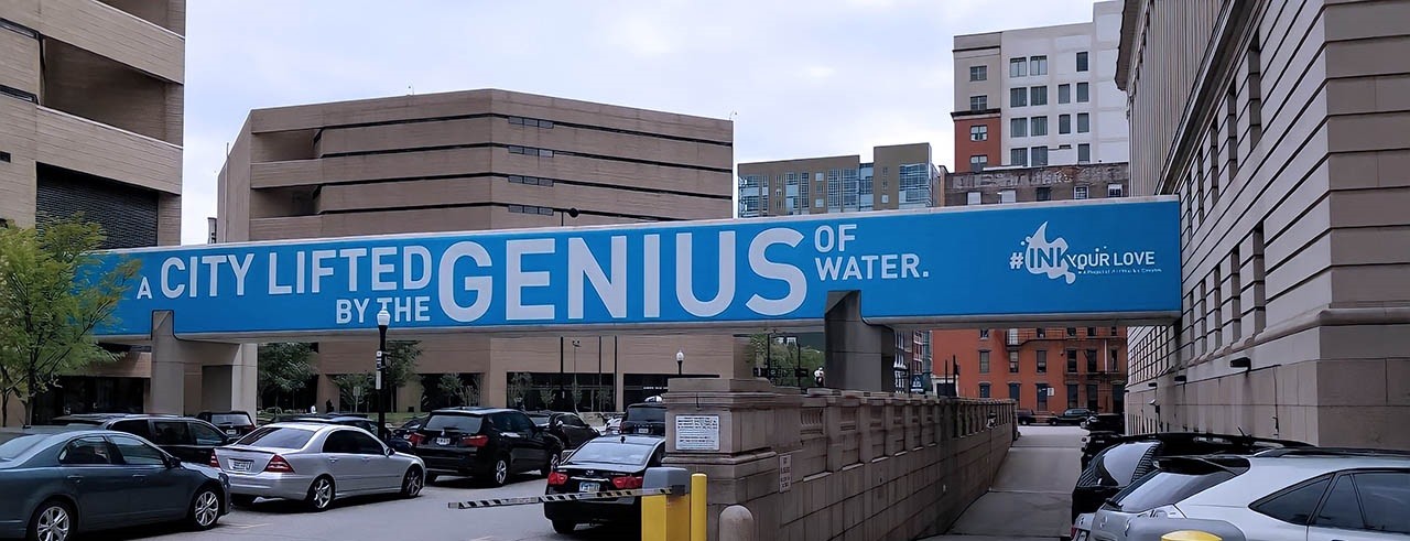 Banner with text "A city lifted by the Genius of water"