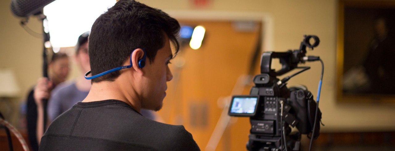 A media production student working on a film shoot.