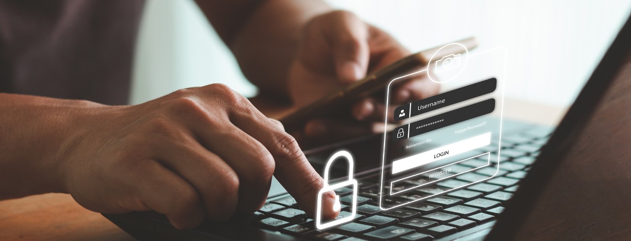 Person at laptop with phone in hand and security log superimposed