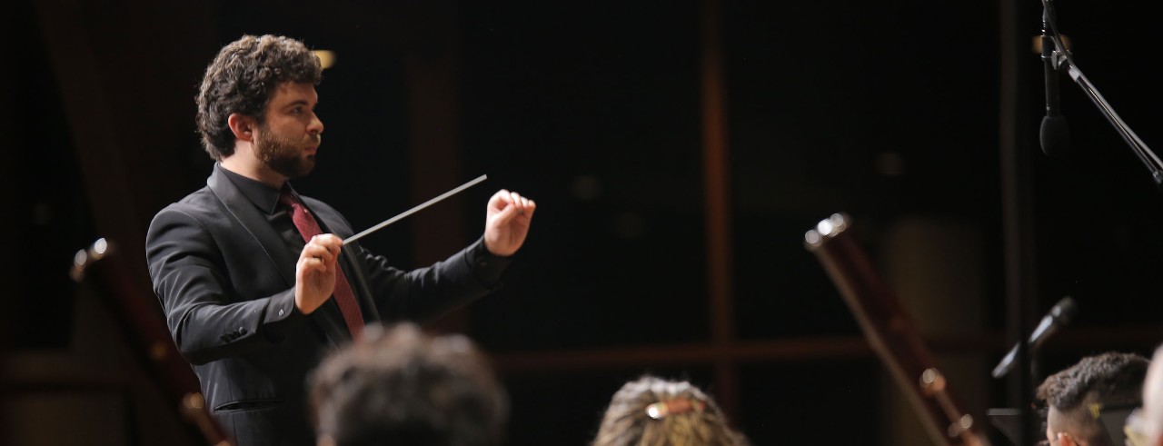 Michael Patterson conducting on stage
