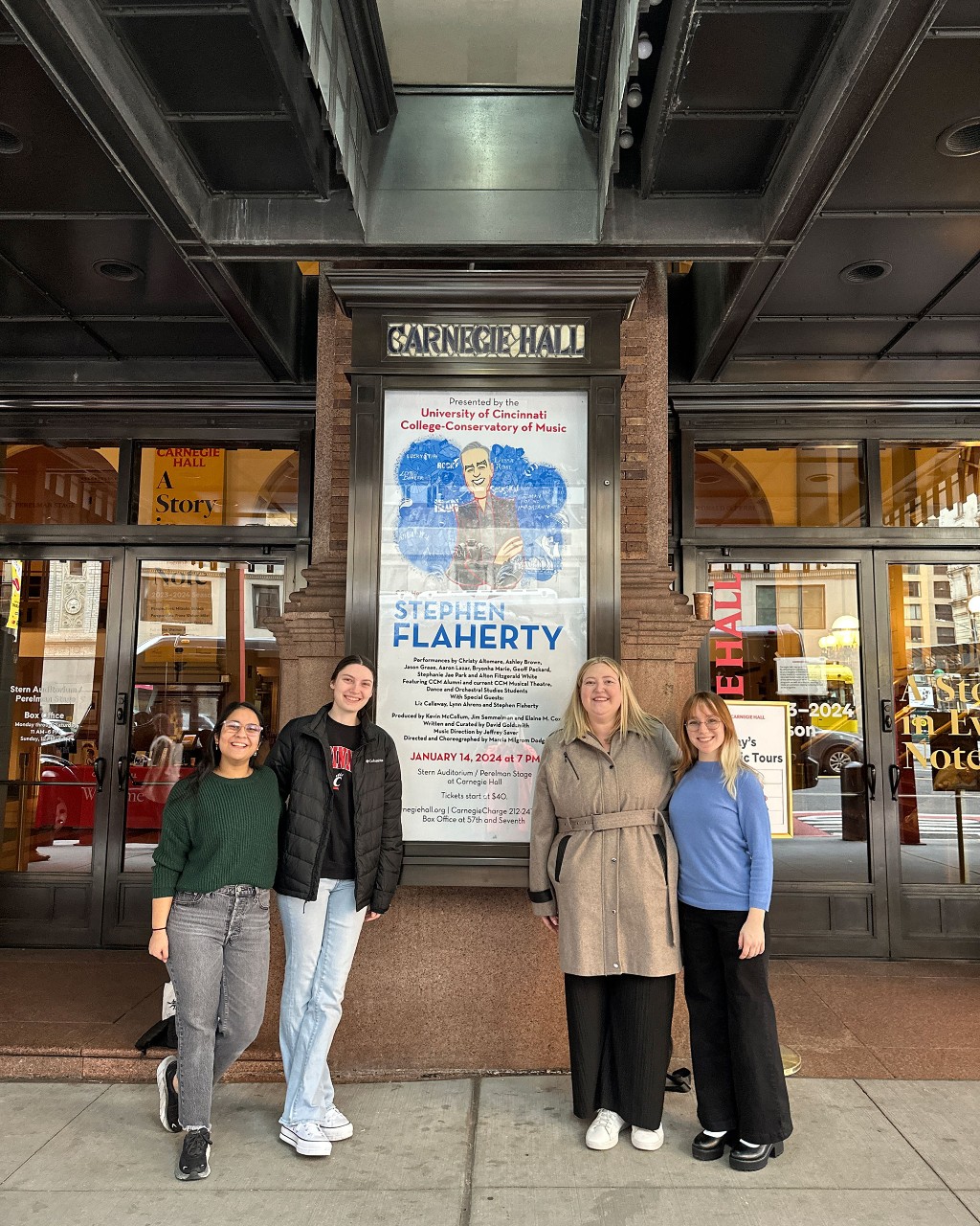 CCM students post in front of the Carnegie Hall poster. Photo provided by Kali Ashurst.