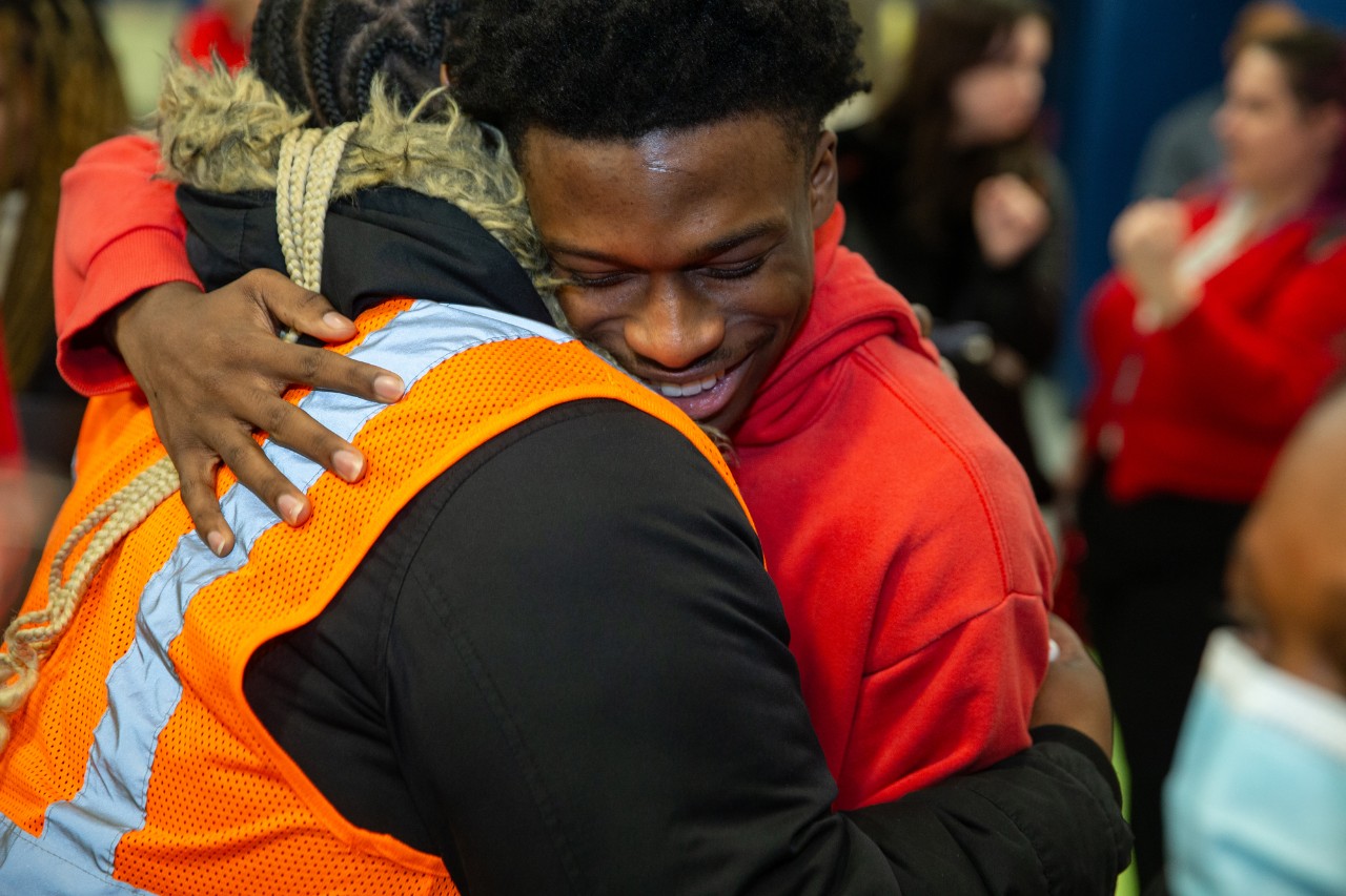 UC surprises Marian Spencer Scholar Zamir Frazier at Riverview East Academy on Decision Day.