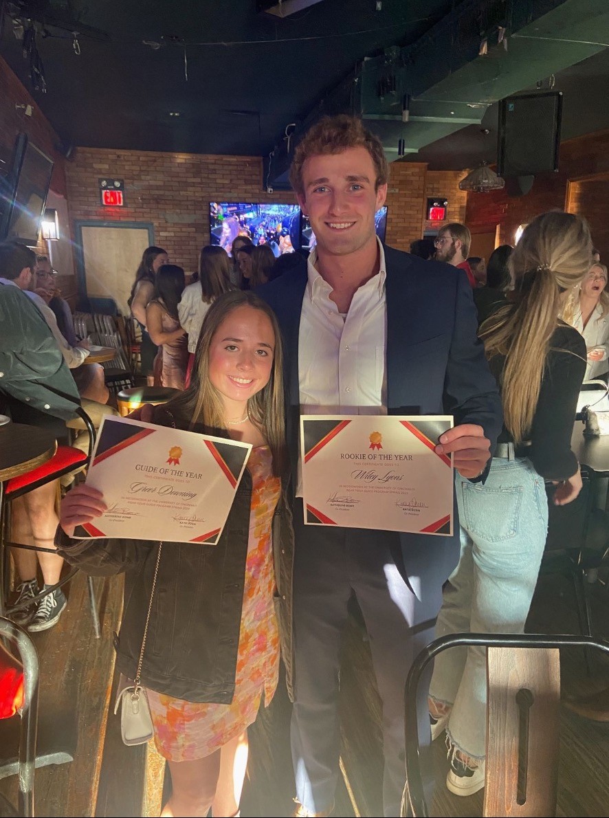 Greer with a certificate