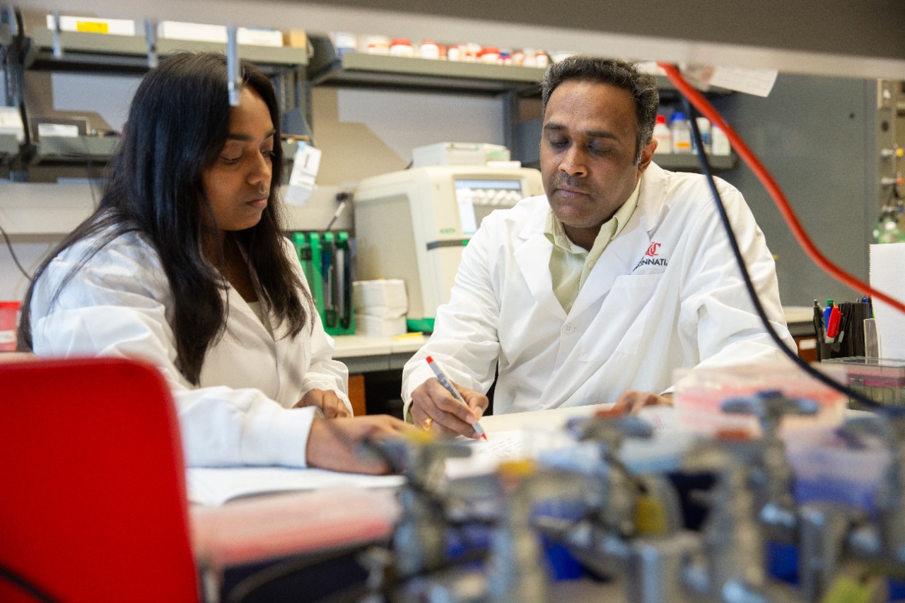 a graduate student and researcher in a medical lab
